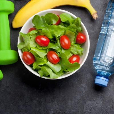 Healthy food concept. Salad, fruits, vegetables, nuts and cereal. Top view flat lay